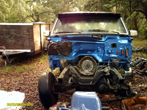 1992 Ford Bronco - Front view of a disassembled vehicle chassis, possibly a Ford Bronco, undergoing restoration.