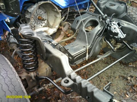 1992 Ford Bronco - The chassis and drivetrain of a 1992 Ford Bronco are shown, indicating it is a budget restoration project.