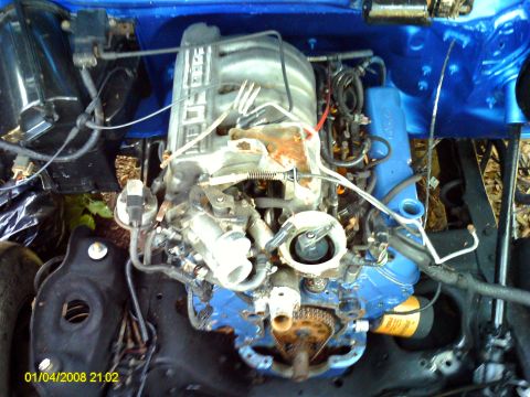 1992 Ford Bronco - Close-up view of a Ford V8 engine, showing the intake manifold and various hoses and wires.