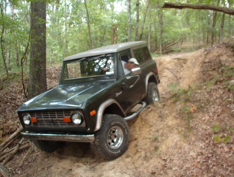 1975 Ford Bronco - At the bottom of the sled, he got lined up to go back over the burm & thru the gate.