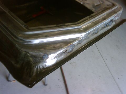 1979 Ford F-250 - Close-up of a metal panel showing recent welding work, indicating body repair or customization.