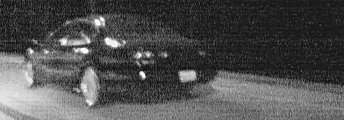 1999 Ford Taurus - A 1999 Ford Taurus is seen from a 3/4 front angle at night.