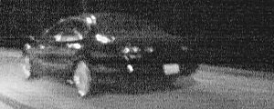 1999 Ford Taurus - This 1999 Ford Taurus is captured in motion at night, showing its front quarter profile.