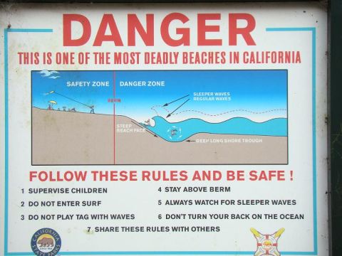 1989 Ford Bronco - This sign warns beachgoers of dangerous conditions and lists rules for safety, including supervising children and staying above the berm.