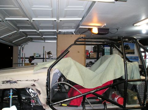 1986 Toyota Hilux - This custom buggy is undergoing modifications inside a garage with the door open.