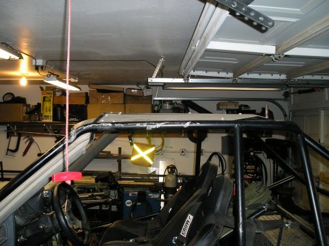 1986 Toyota Hilux - Custom roll cage and racing seats are visible inside the modified truck.