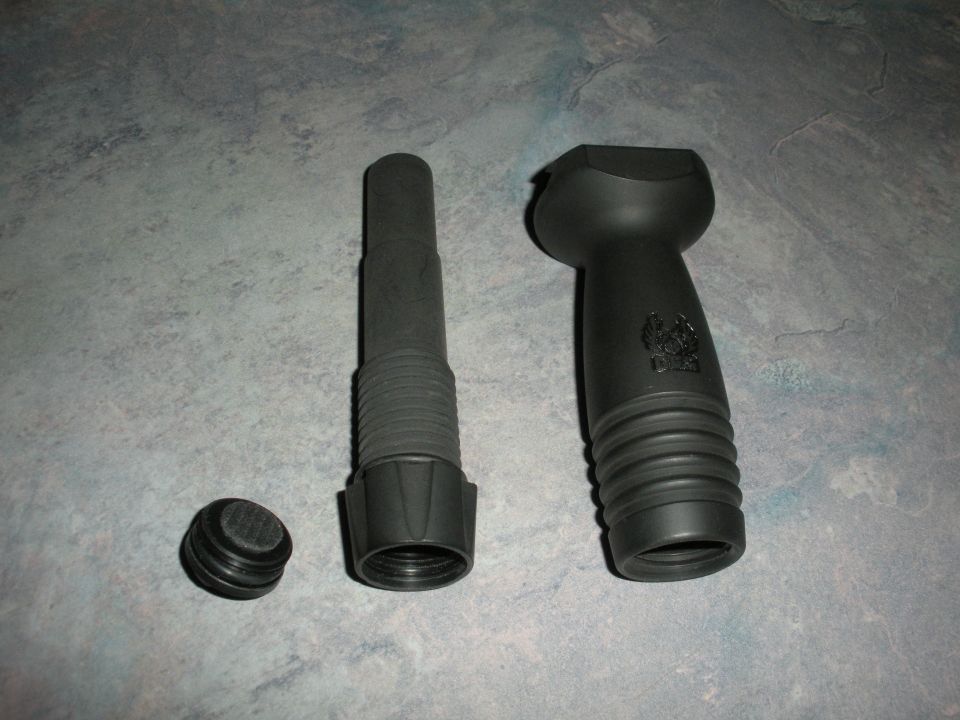 Black plastic automotive funnel with cap and a separate handle piece
