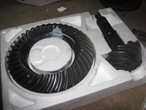 1995 Ford Bronco - A differential ring gear and pinion gear set are shown packed in white foam packaging.