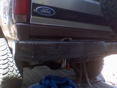 1993 Ford Bronco - Rear view of a 1993 Ford Bronco, showing the bumper and spare tire.