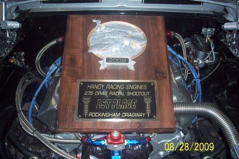 1992 Ford Mustang - A trophy commemorating the 2009 Handy Racing Engines 275 Drag Radial Shootout at Rockingham Dragway is displayed in an engine bay.