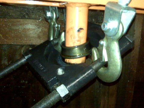 1995 Ford Bronco - Bearing separator tool is attached to an orange pipe, likely for maintenance or repair.