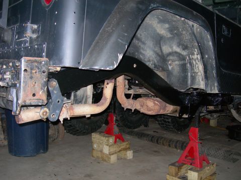 1991 Jeep Wrangler - Rear view of a 1991 Jeep Wrangler showing the axle, suspension, and exhaust system.