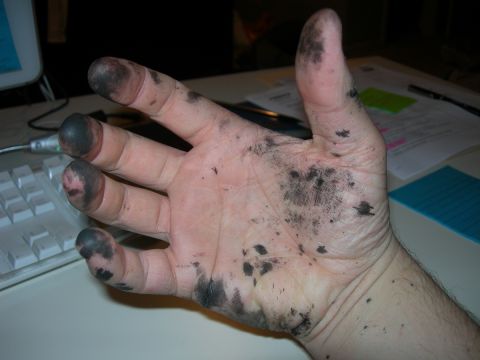 1991 Jeep Wrangler - Hands covered in grease after working on a vehicle.