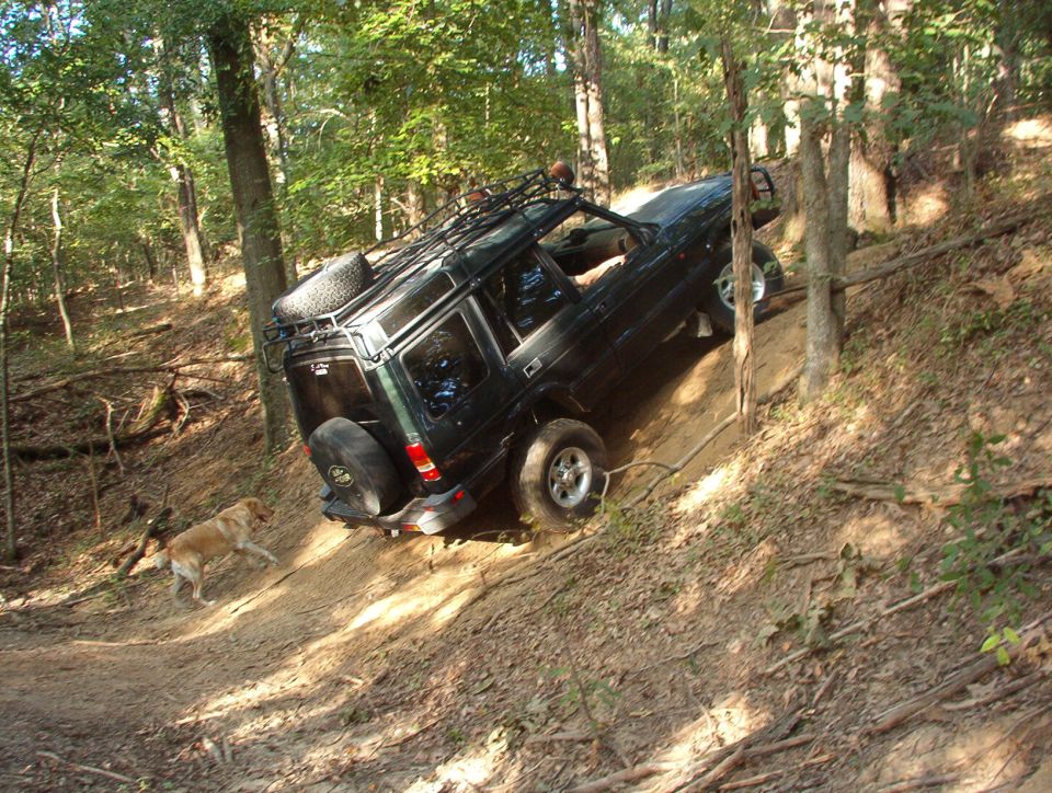 Of course, as soon as he got enough bolts to put the d'shaft back in, we had to take it for a shakedown cruise in his back yard.  He went straight for this hill, with both his kids in the back  seat & a passenger up front.  Even his 3-legged dog went along.