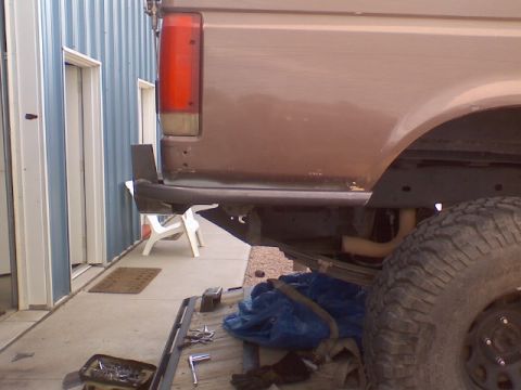 1993 Ford Bronco - Rear view of a 1993 Ford Bronco showing the bumper and tire.