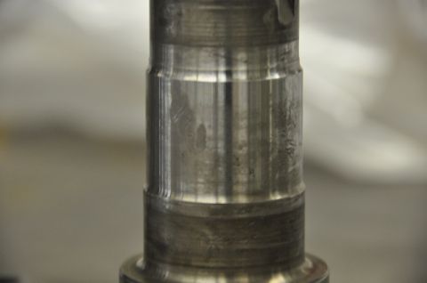 1996 Ford Bronco - This is a close-up view of a metal spindle part, showing signs of wear.