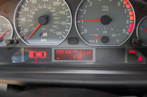 2002 BMW M3 - The instrument cluster shows 99,700 miles and the M logo, indicating it is from a BMW M3.