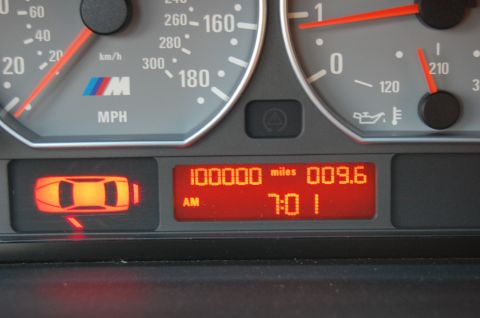 2002 BMW M3 - Instrument cluster from a BMW M3 displays 100,000 miles and the time 7:01 AM.