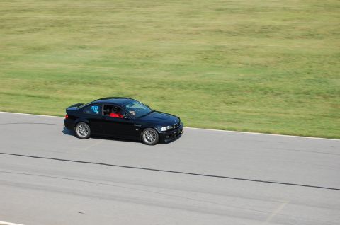 2002 BMW M3 - A black 2002 BMW M3 is seen on a racetrack, displaying the number 98.