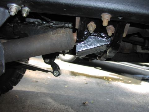 1986 Ford Bronco - A close-up view of the undercarriage reveals suspension components and an exhaust pipe, with a Supermotors.net watermark visible.