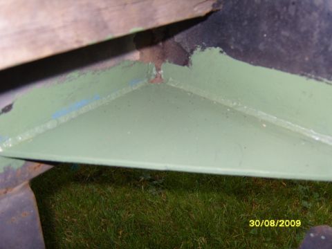 1989 Ford Bronco - Close-up of a painted metal component, possibly part of a vehicle frame, with a date watermark.