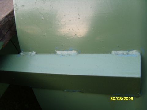 1989 Ford Bronco - The photo shows a close-up of painted metal with visible welds, along with a date and website watermark.