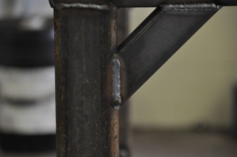1996 Ford Bronco - Detail of a welded metal frame construction, showing joints and bracing.