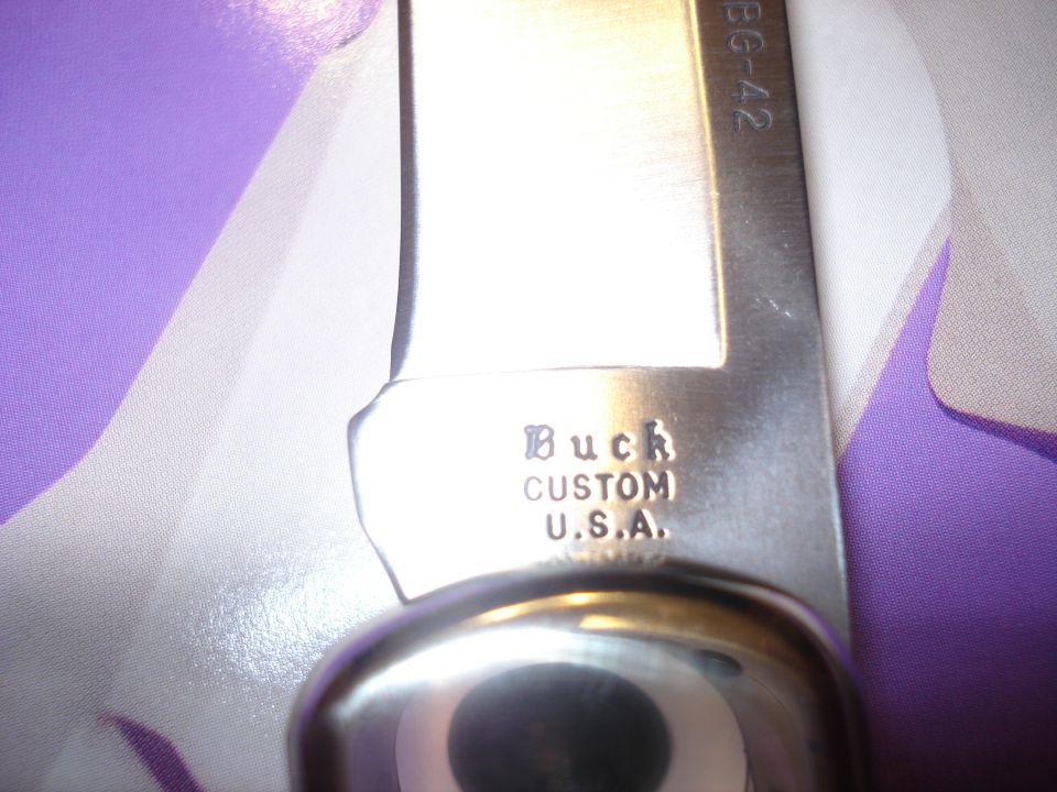 Buck Custom U.S.A. knife blade with BG-42 marking, close-up