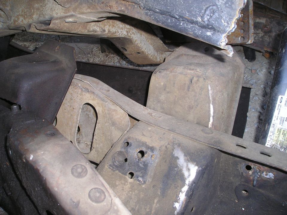 1986 Ford Bronco II frame and suspension parts, showing rust and wear