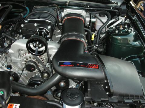 1998 Ford Crown Victoria - Close-up of a modified engine, a prominent supercharger and intake system.