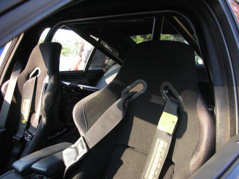 1998 Ford Crown Victoria - The interior features racing seats and a roll cage, suggesting performance modifications.