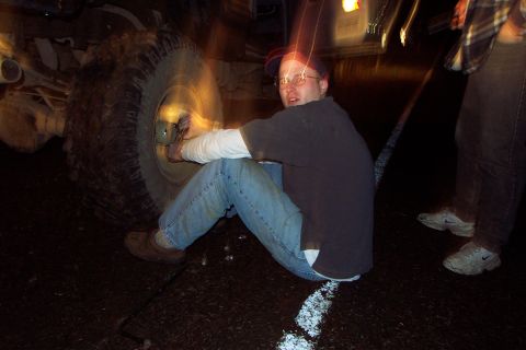 1989 Ford F-150 - Putting the wheel back on. Wow he's moving fast.