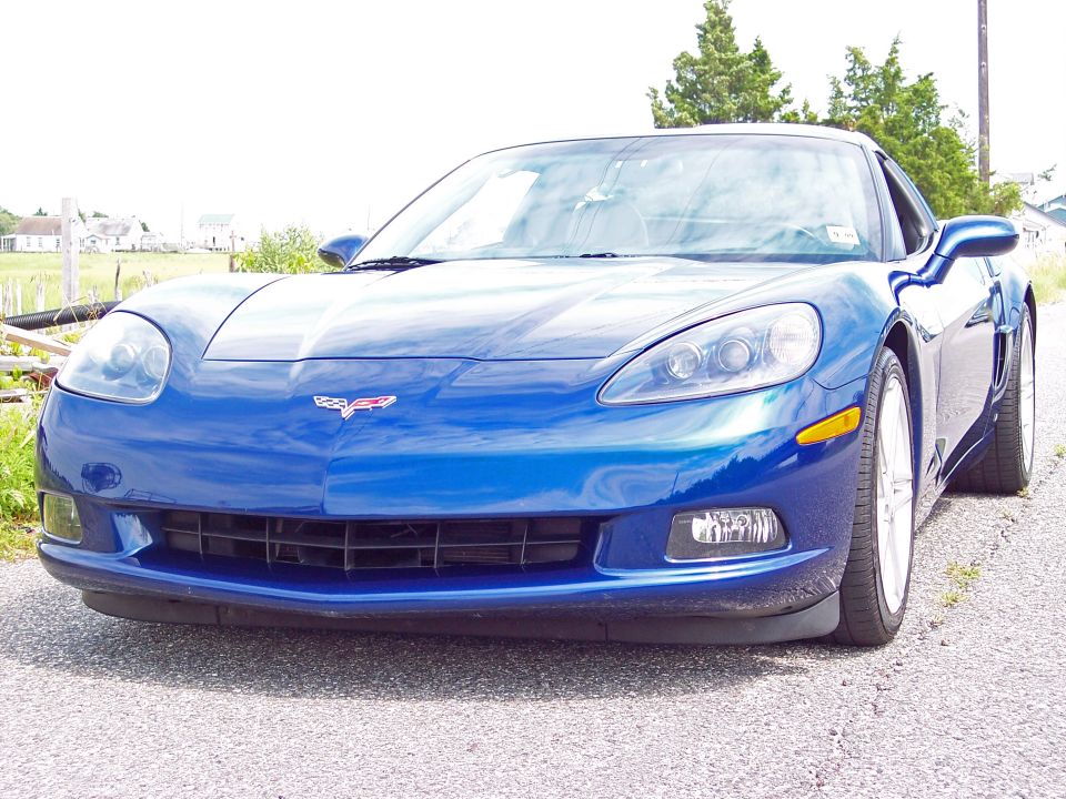 Blue Chevrolet Corvette front view. Album claims 2006 Z06 bumper, but this is a standard C6