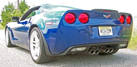 2006 Chevrolet Corvette - Rear view of a blue 2006 Chevrolet Corvette, its quad exhaust pipes and distinctive taillights.