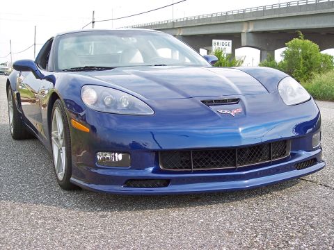 2006 Chevrolet Corvette - Front view of a blue 2006 Chevrolet Corvette Z06 parked on asphalt.