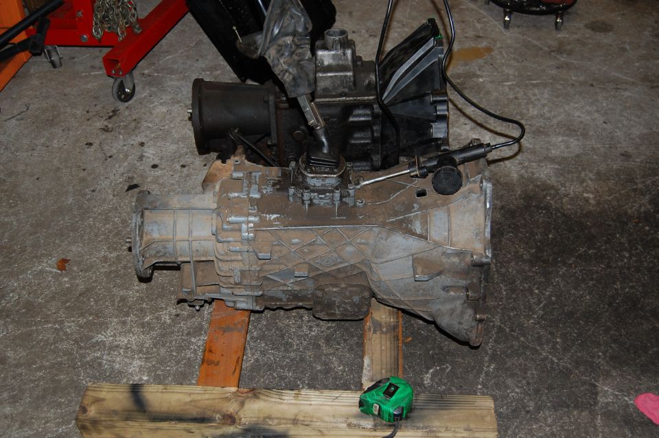 transmission and transfer case assembly on wooden blocks