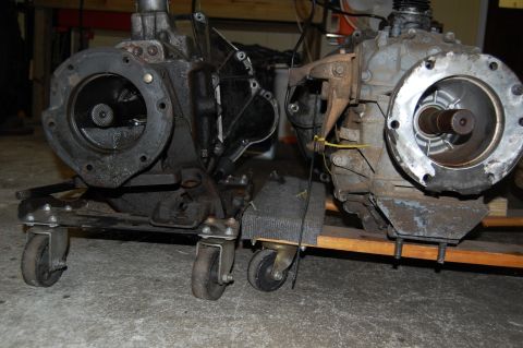 1994 Ford Bronco - Two transmission assemblies are shown, each mounted on a wheeled dolly for transport.