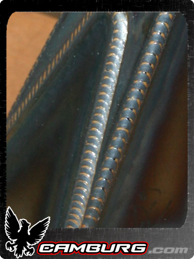 1996 Ford Bronco - This image shows detailed welding seams on a metal surface, with a logo indicating CAMBURG.COM.