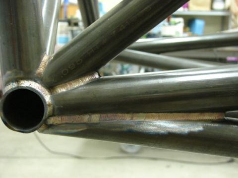 1996 Ford Bronco - Welded metal tubing with visible text "x.095 H" on its surface.