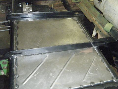 1978 Ford Bronco - Close-up of welded metal panels on a vehicle's underbody, indicating repair or modification work.