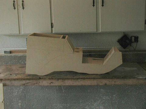 1985 Ford Bronco - A rough mock-up of a vehicle's center console sits on a workbench.