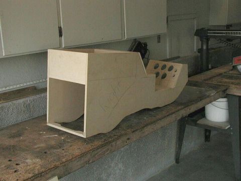 1985 Ford Bronco - Unfinished wooden center console part with cutouts for gauges, likely for a custom build.