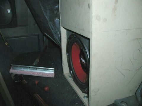 1985 Ford Bronco - A custom subwoofer is installed in the interior of a vehicle, alongside other items on-floor items.