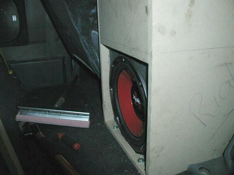 Sony Xplod subwoofer in MDF box mounted inside a vehicle interior
