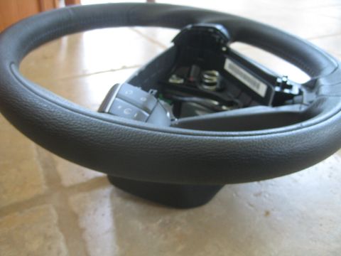1993 Ford Probe - Close-up view of a steering wheel, showing its textured surface and control buttons.