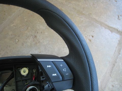 1993 Ford Probe - This image shows a close-up of a steering wheel with integrated audio controls, not a 1993 Ford Probe.