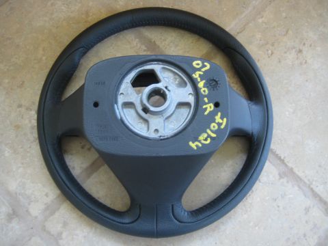 1993 Ford Probe - A steering wheel part is shown, with yellow markings on the hub.