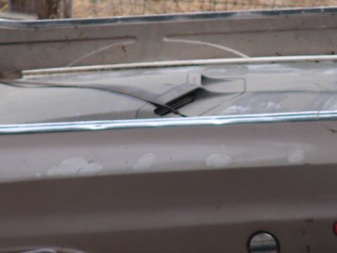 1973 Ford Ranchero - Close-up view of a truck bed's rear section, showing weathered paint and trim details.