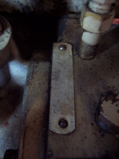 1981 Kenworth W900A - A close-up view of a metal identification plate attached to an engine part, showing stamped alphanumeric characters.