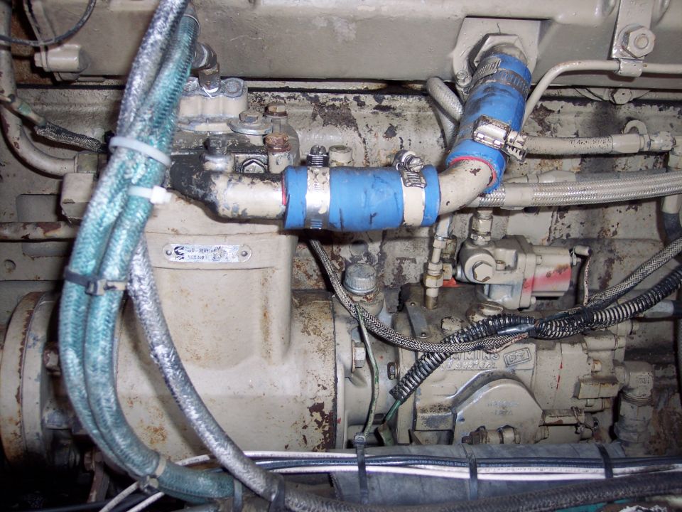 close-up of engine parts, hoses, and wiring